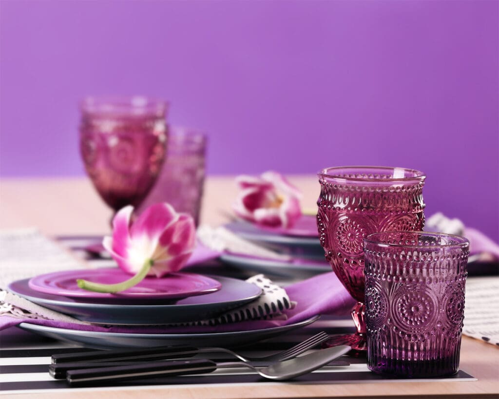 Purple toned drinking glasses in cut glass design