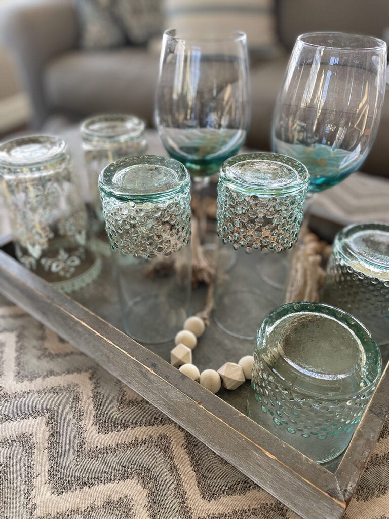tray of drinking glasses in assorted sizes all sharing a blue tone