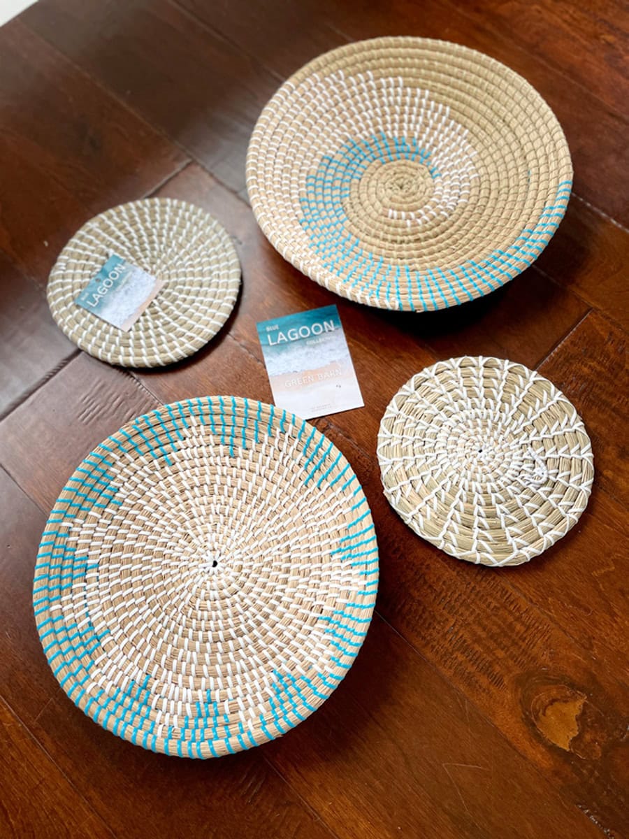 Close-up of seagrass baskets showcasing the gorgeous, intricate handwoven patterns in coastal colors, adding a touch of artistry to the decor