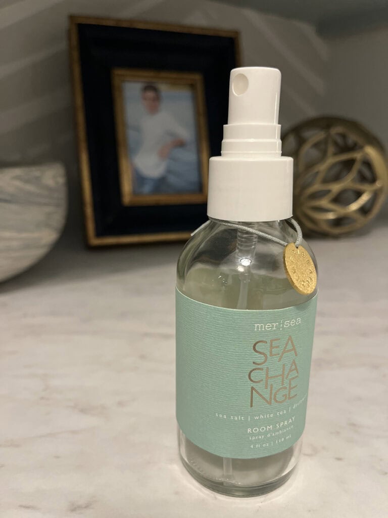 bottle of Mersea Sea Change room spray on counter