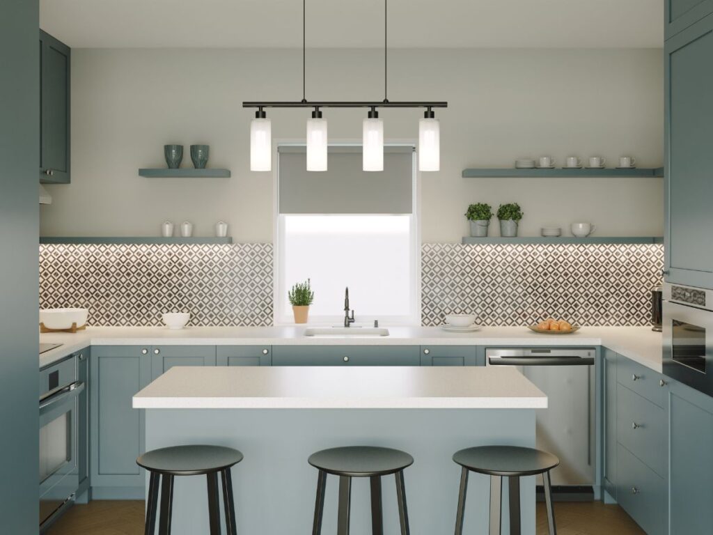 Blue-gray painted cabinets with a clean coastal finish and shaker style drawers.
