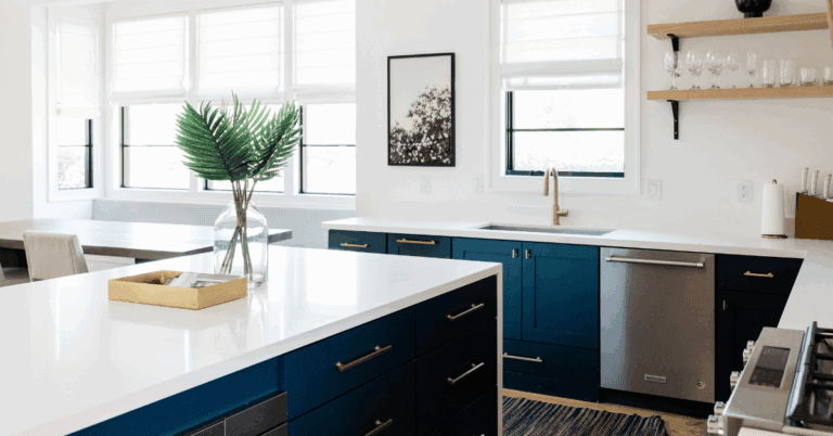 Clear kitchen island styled with a single vase and tray—an example of what to do when you have too much stuff and not enough space