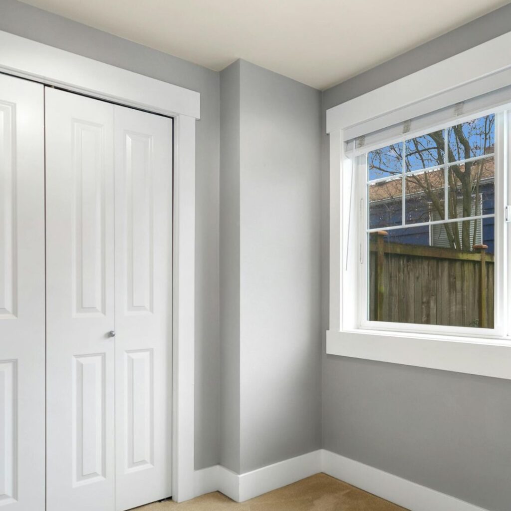 Crisp white trim framing gray walls, showing how the best white paint makes wall colors pop and stay timeless.