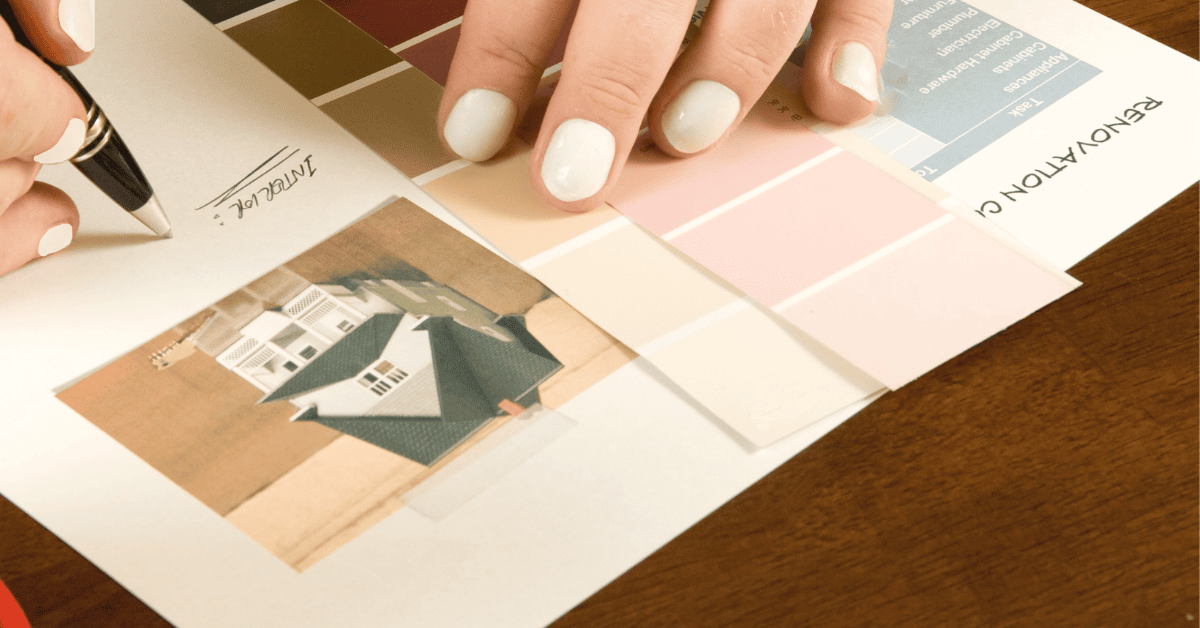 Designer workspace with home floor plans, paint colors, and fabric samples used to plan interior finishes — a realistic home renovation checklist in action.