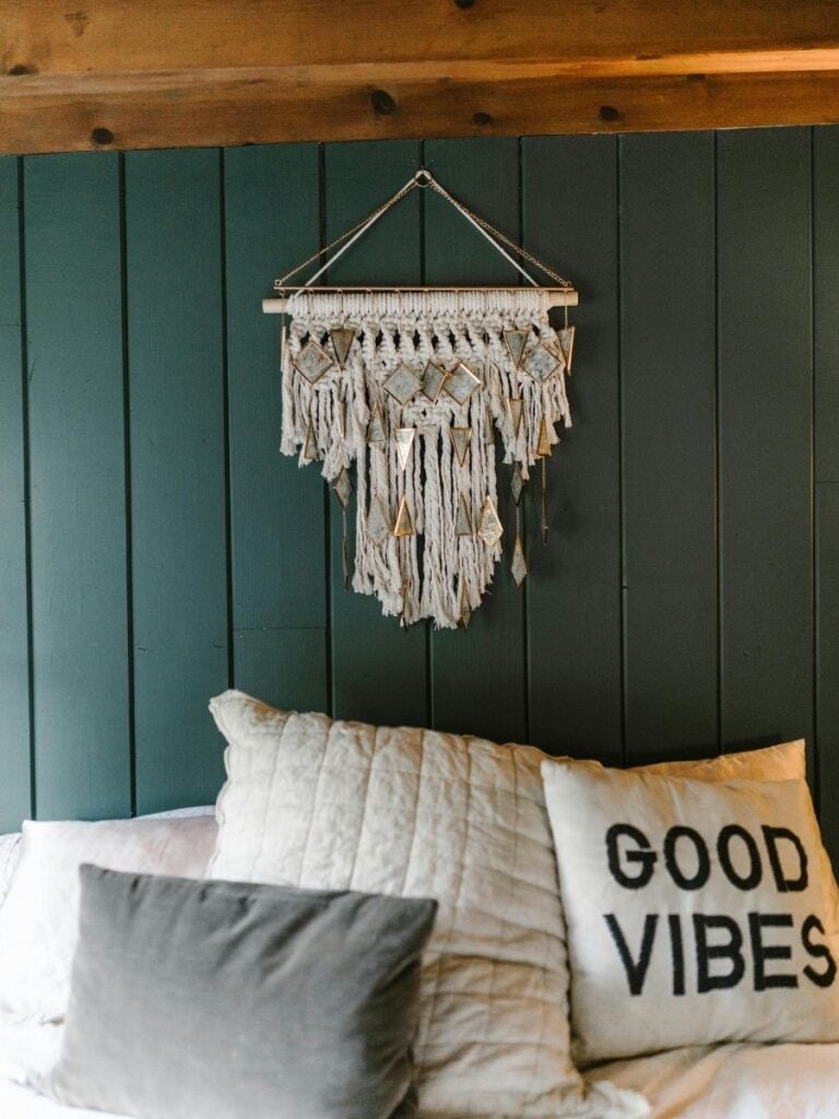 Cozy bedroom showcasing a mix of boho and coastal elements, with woven accents, natural textures, and a calm color palette.