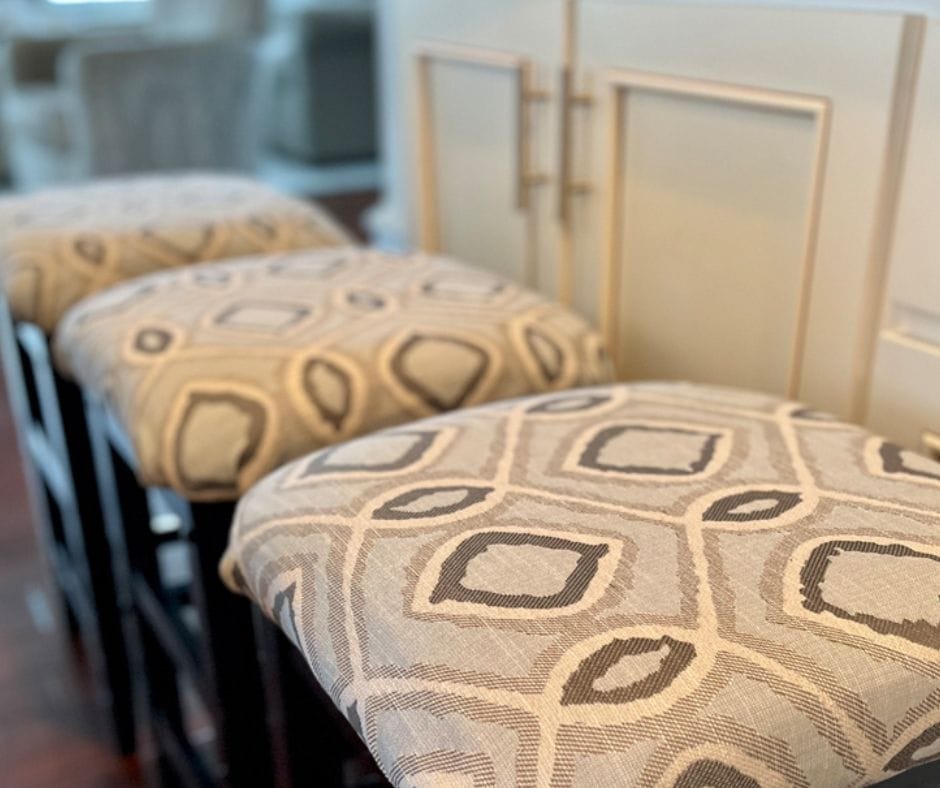 Bar stools with freshly upholstered fabric in a neutral pattern, ready for a spring update.
