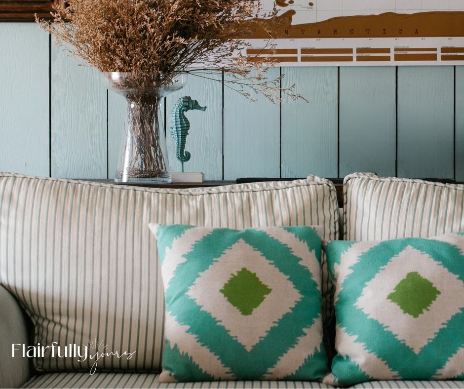 Coastal throw pillows in turquoise and green, adding a fresh spring touch to a neutral sofa.