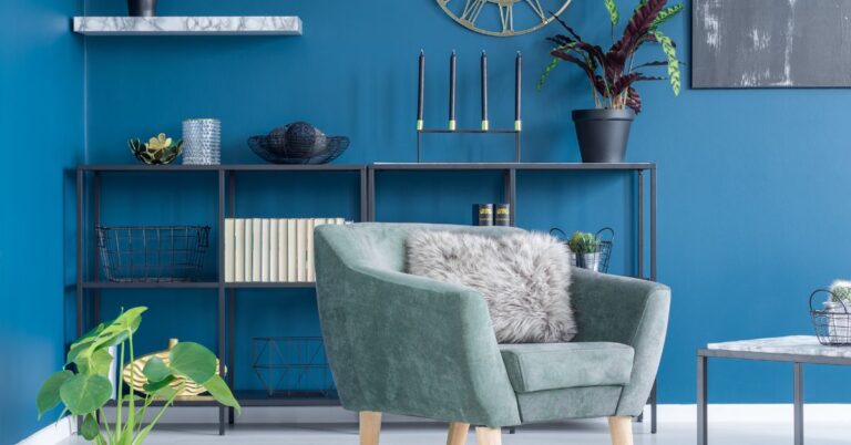 How to decorate with tonal layering blue wall teal chair and coastal accessories showing light-to-dark color flow