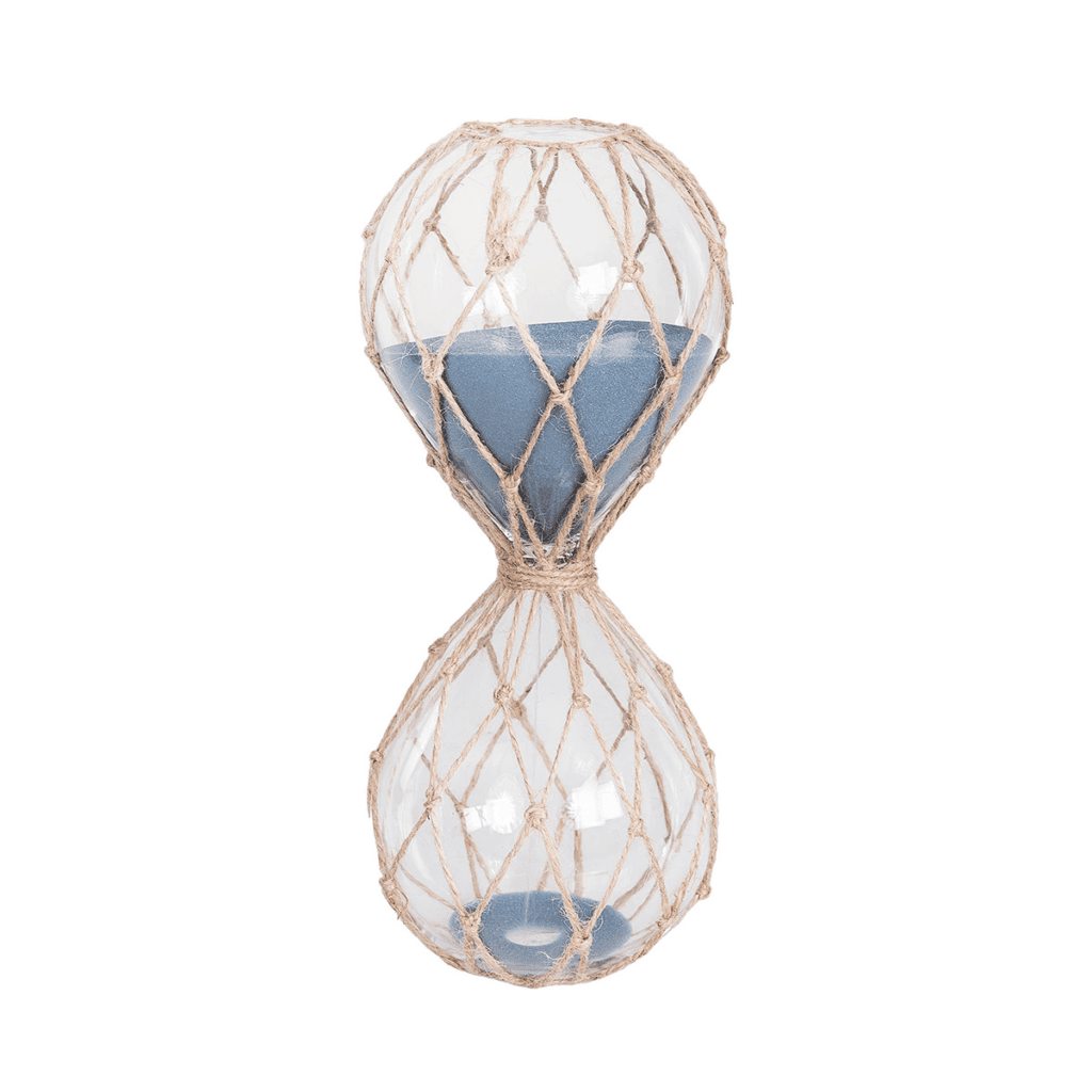 Rope-wrapped glass hourglass with blue sand styled on a coastal console table